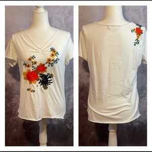 White top with stitched floral pattern